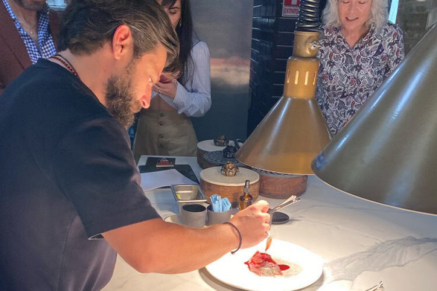 Chef adds last details to a Forma Foods dish with plant-based meat
